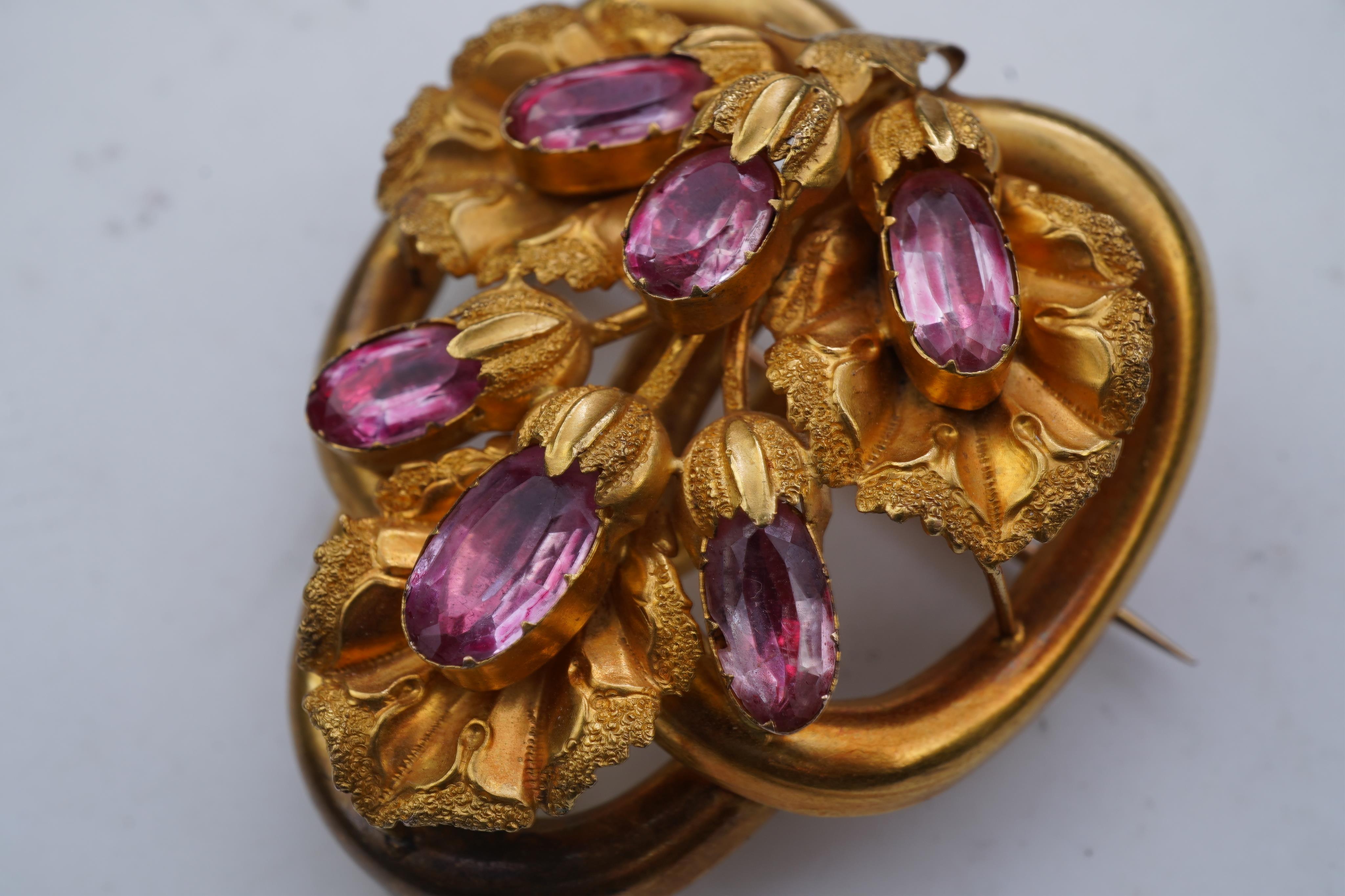 A gold and pink topaz brooch, mid 19th century